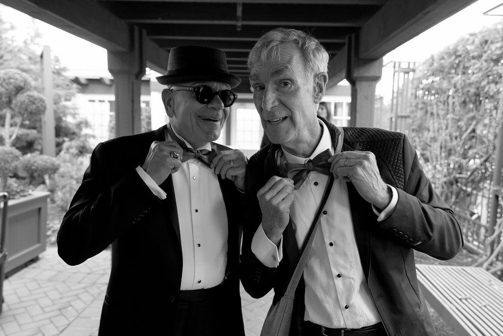 actors fixing bow ties at wedding